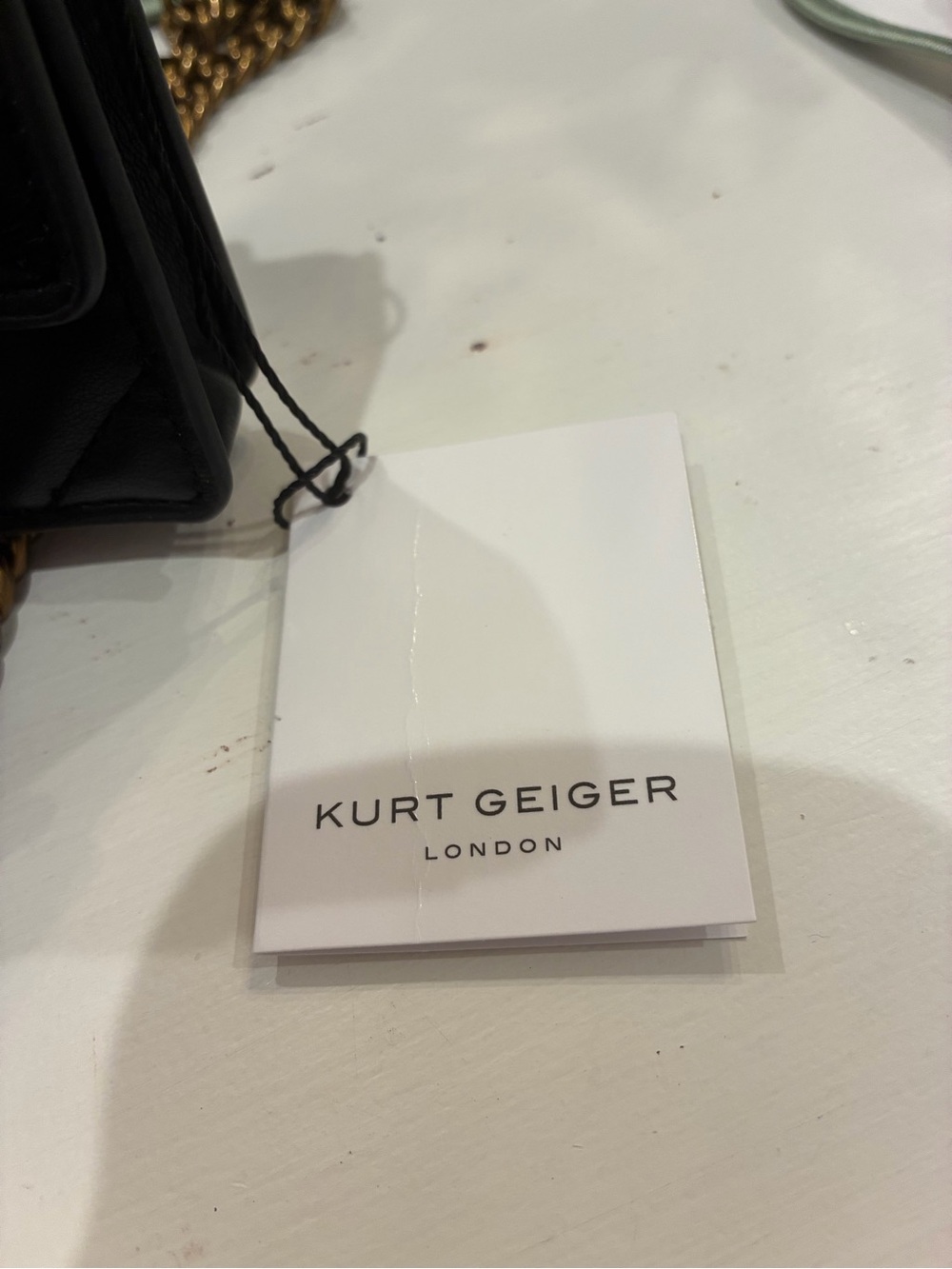 Kurt Geiger Quilted Mini Crossbody in Black with Gold Letters - Picture 4 of 4